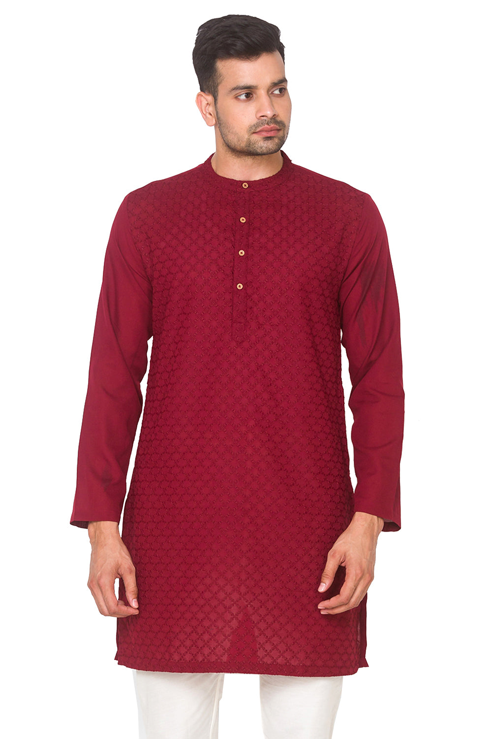 Man wearing a In-Sattva maroon kurta with white pants