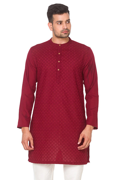 Man wearing a In-Sattva maroon kurta with white pants
