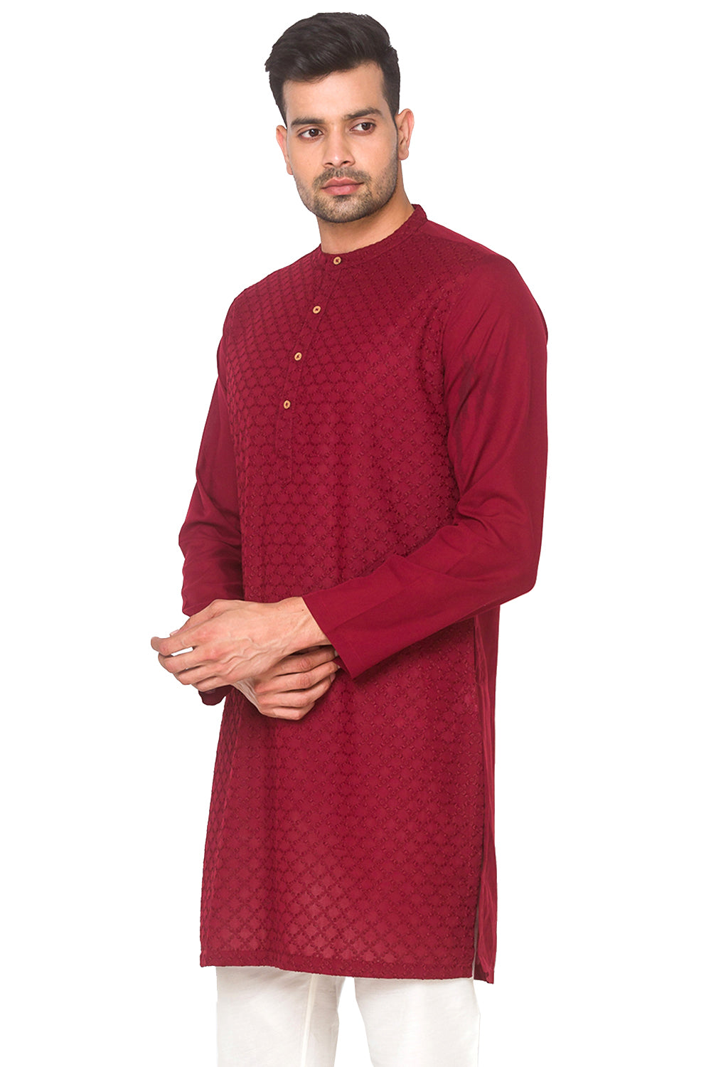 Man wearing a In-Sattva maroon kurta with white pants 