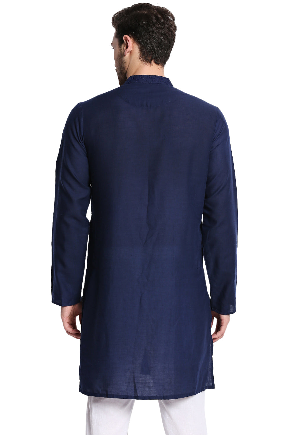 Man wearing a navy blue kurta with white pants - back of the kurta view