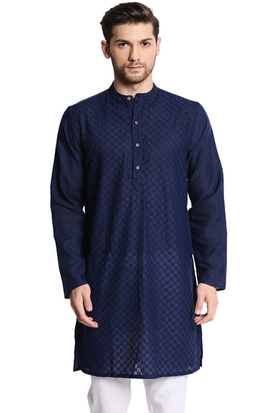 Man wearing a navy blue kurta with white pants on a white background