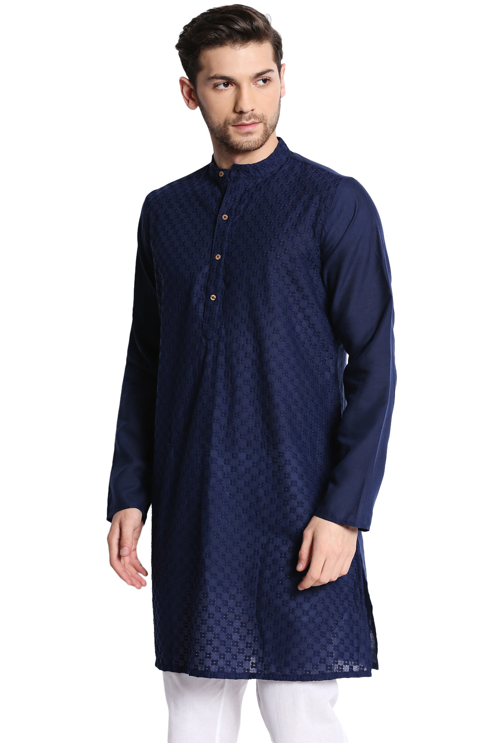 Man wearing a In-Sattva navy blue kurta with white pants