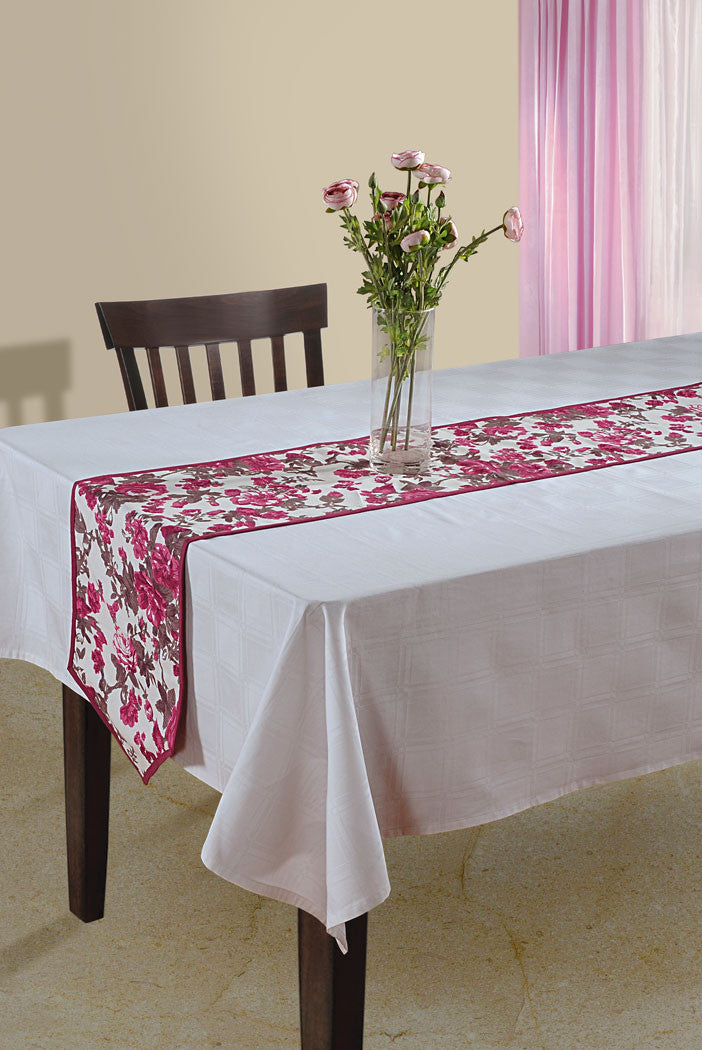 In-Sattva magenta bohemian floral print table runner styled on a white dining table with flowers