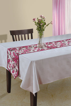 In-Sattva magenta bohemian floral print table runner styled on a white dining table with flowers