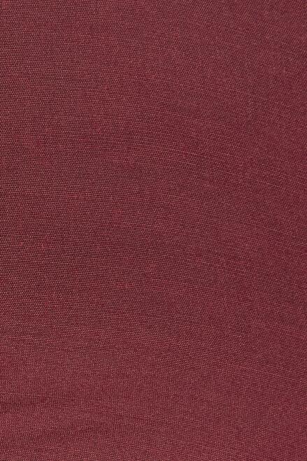 Close-up of In-Sattva men's burgundy art silk churidar pants, highlighting the burgundy color, smooth weave and subtle sheen of the art silk fabric.
