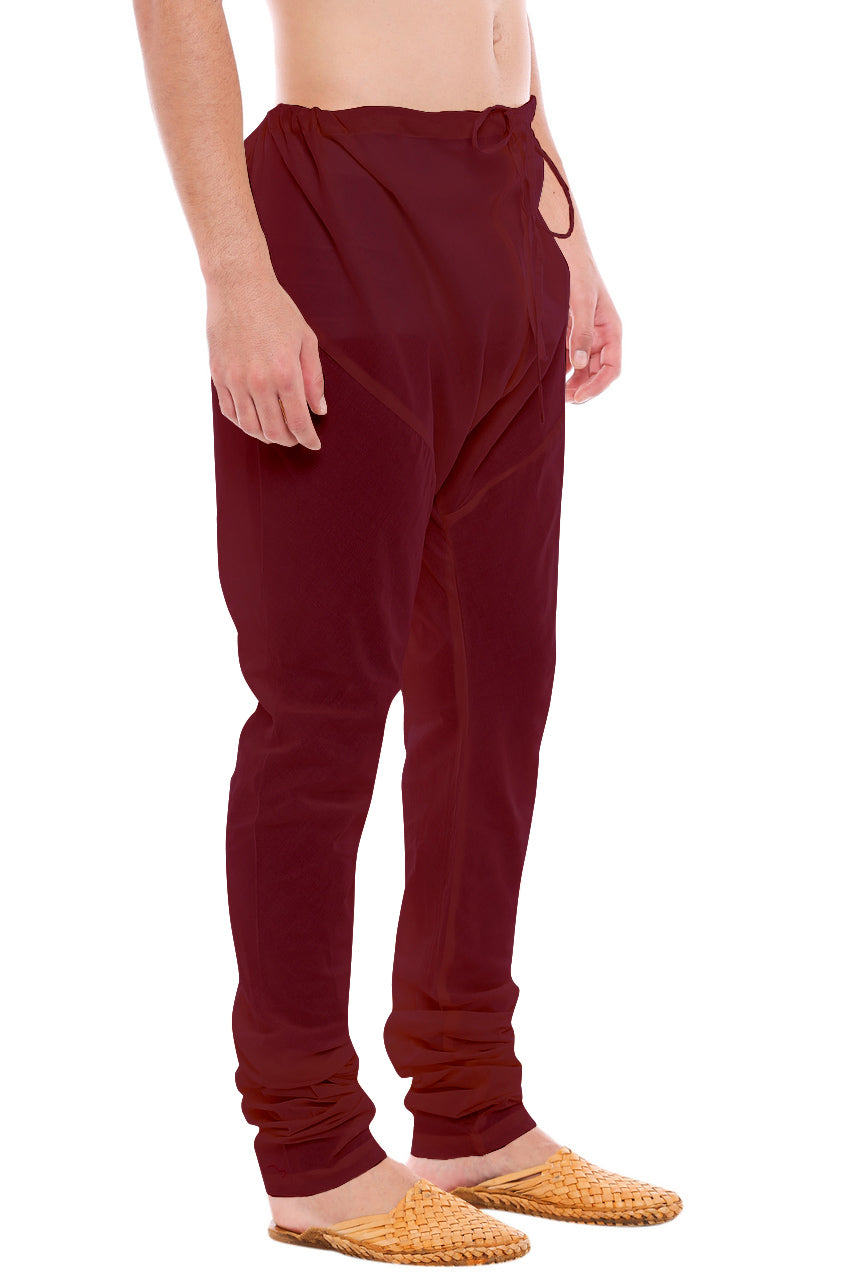 Left profile view of In-Sattva men's burgundy art silk churidar pants, showing the smooth art silk sheen and gathered ankle fit.
