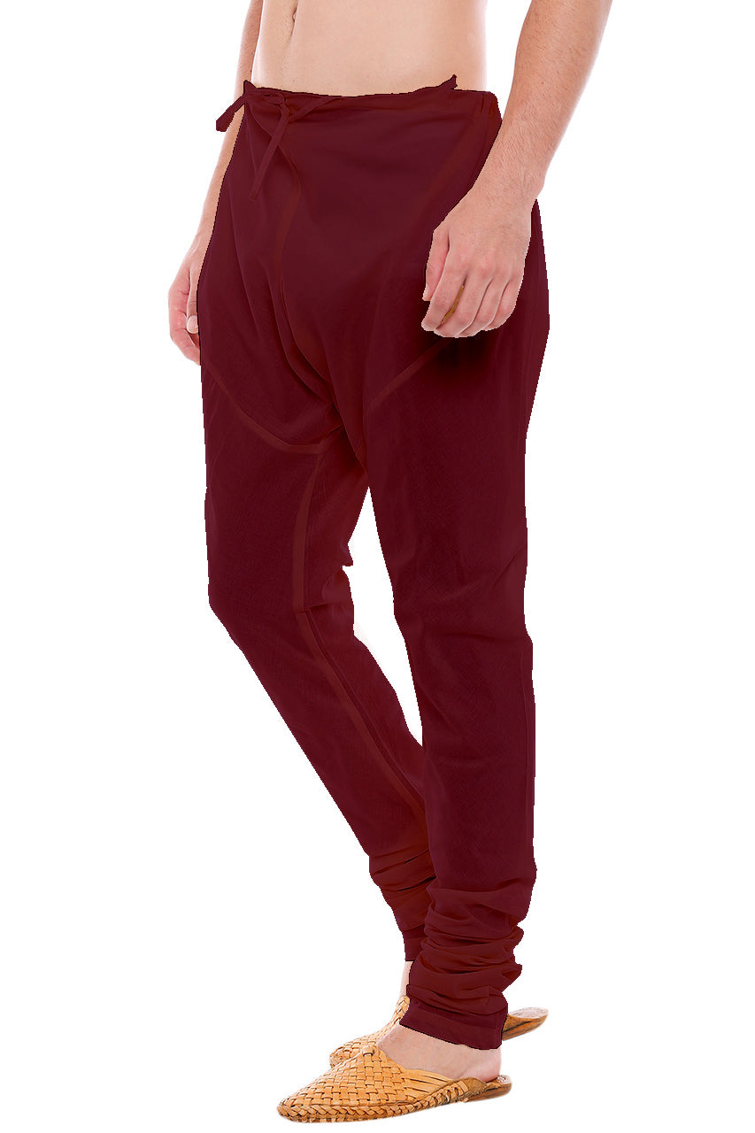 Right profile view of In-Sattva men's burgundy art silk churidar pants, showing the smooth art silk sheen and gathered ankle fit.