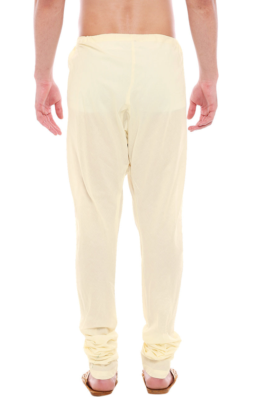 Back view of In-Sattva men's cream art silk churidar pants, showing the tapered full-length fit and ankle gathers from the back.