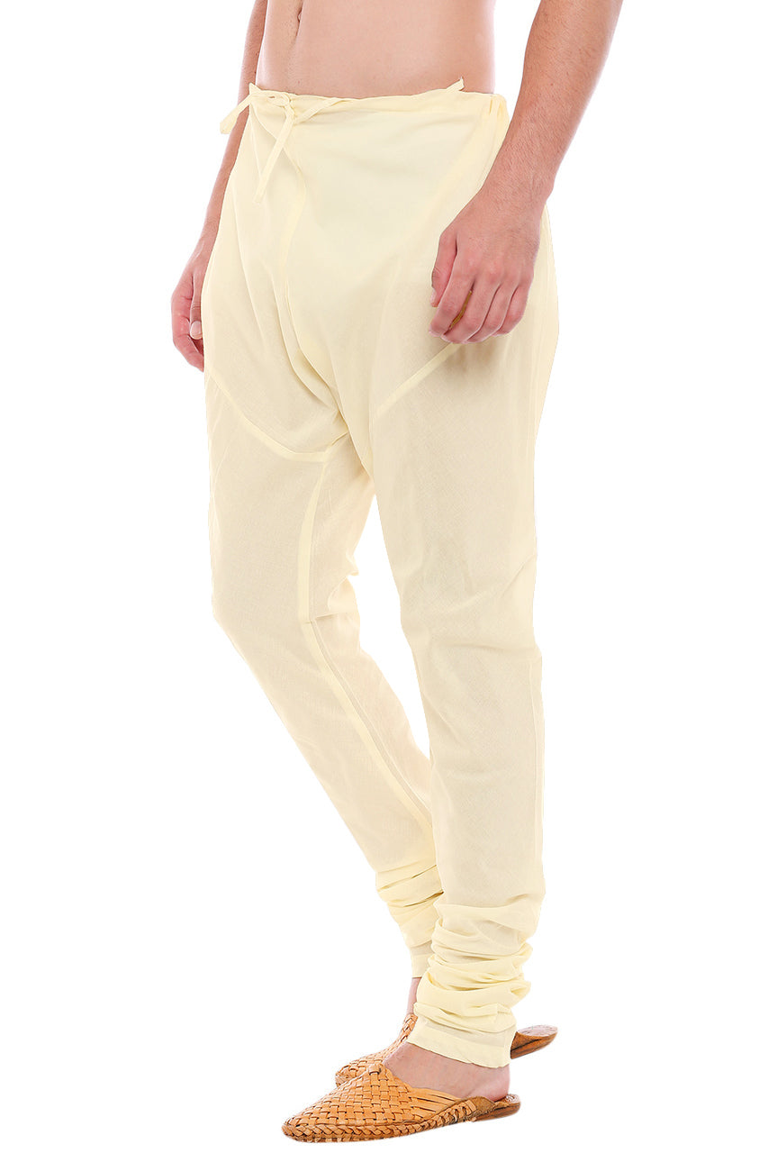 Right profile view of In-Sattva men's cream art silk churidar pants, showing the smooth art silk sheen and gathered ankle fit.