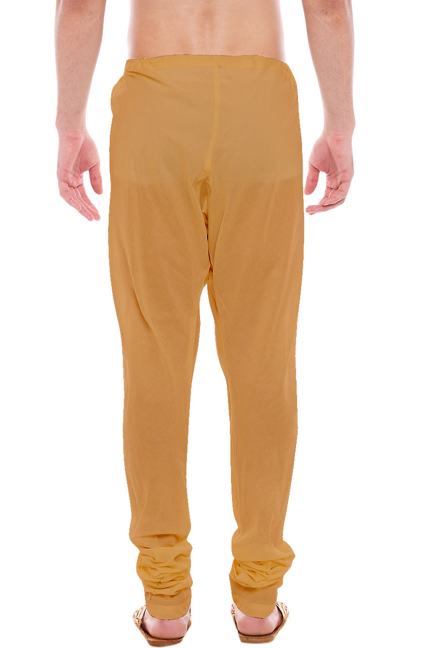 Back view of In-Sattva men's gold art silk churidar pants, showing the tapered full-length fit and ankle gathers from the back.