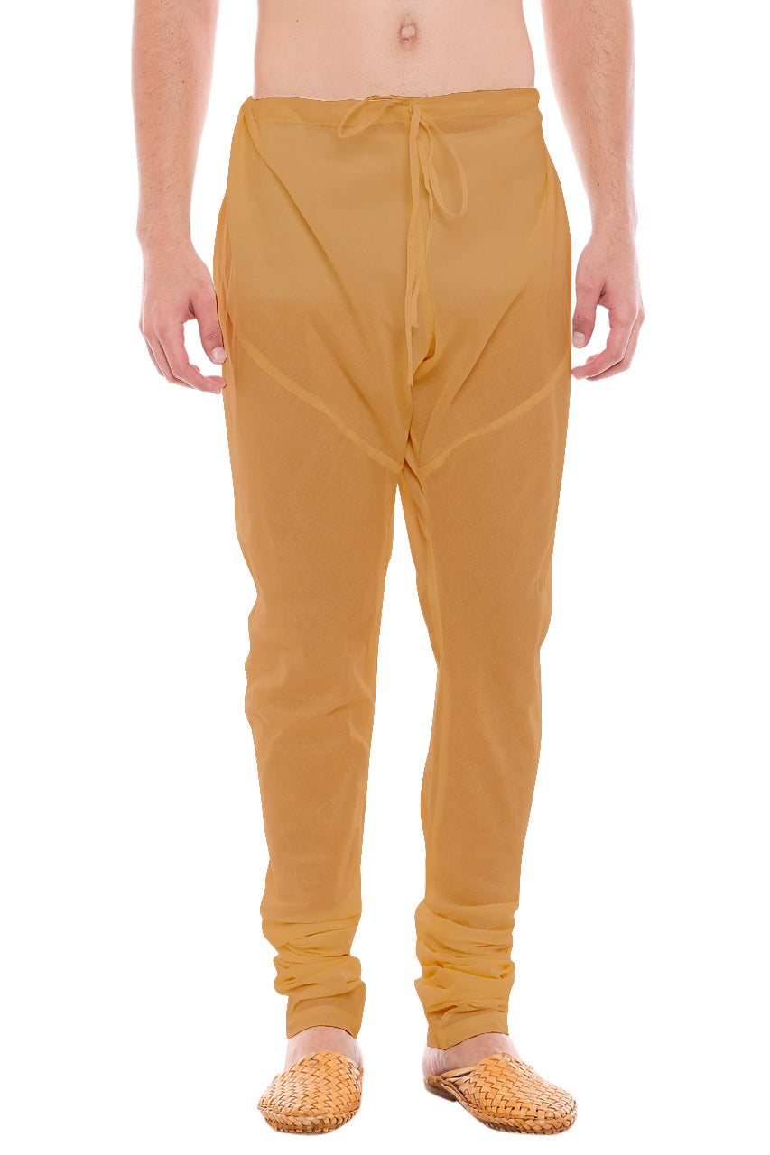 Front view of In-Sattva men's gold art silk churidar pants, showing the drawstring waist, tapered legs and ankle gathers.