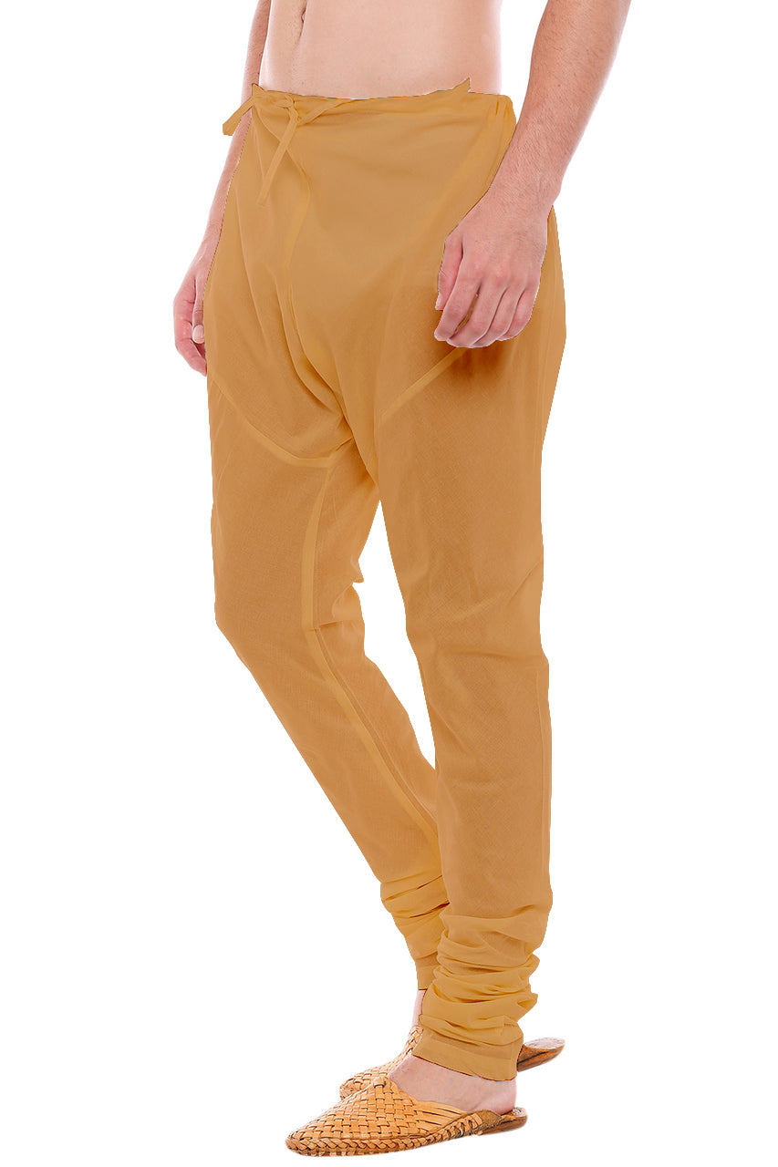 Right profile view of In-Sattva men's gold art silk churidar pants, showing the lustrous art silk finish and gathered ankle fit.