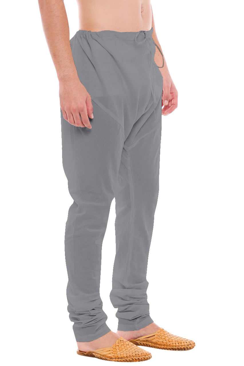 Left profile view of In-Sattva men's gray art silk churidar pants, showing the smooth art silk sheen and gathered ankle fit.