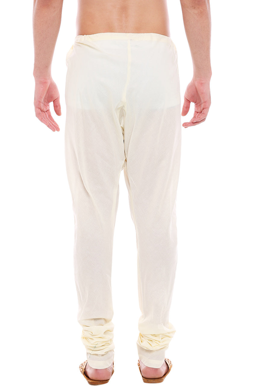 Back view of In-Sattva men's off-white cotton churidar pants, showing the tapered full-length fit and ankle gathers from the back.