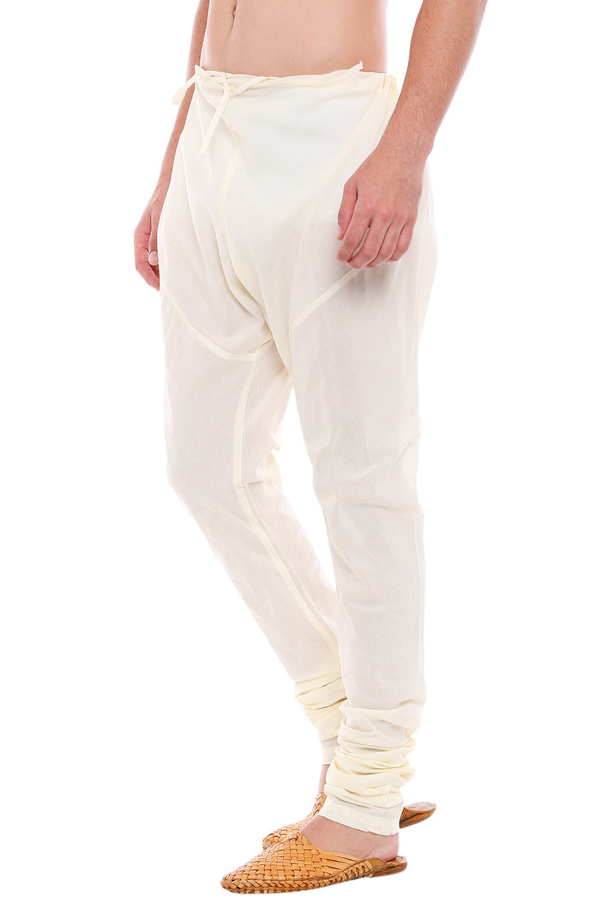 Right profile view of In-Sattva men's off-white cotton churidar pants, showing the smooth cotton profile and gathered ankle fit.