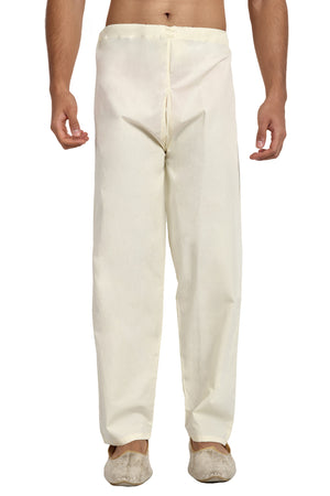 Front view of In-Sattva men's off-white cotton drawstring lounge pants, showing the drawstring waistband and relaxed straight-leg fit.