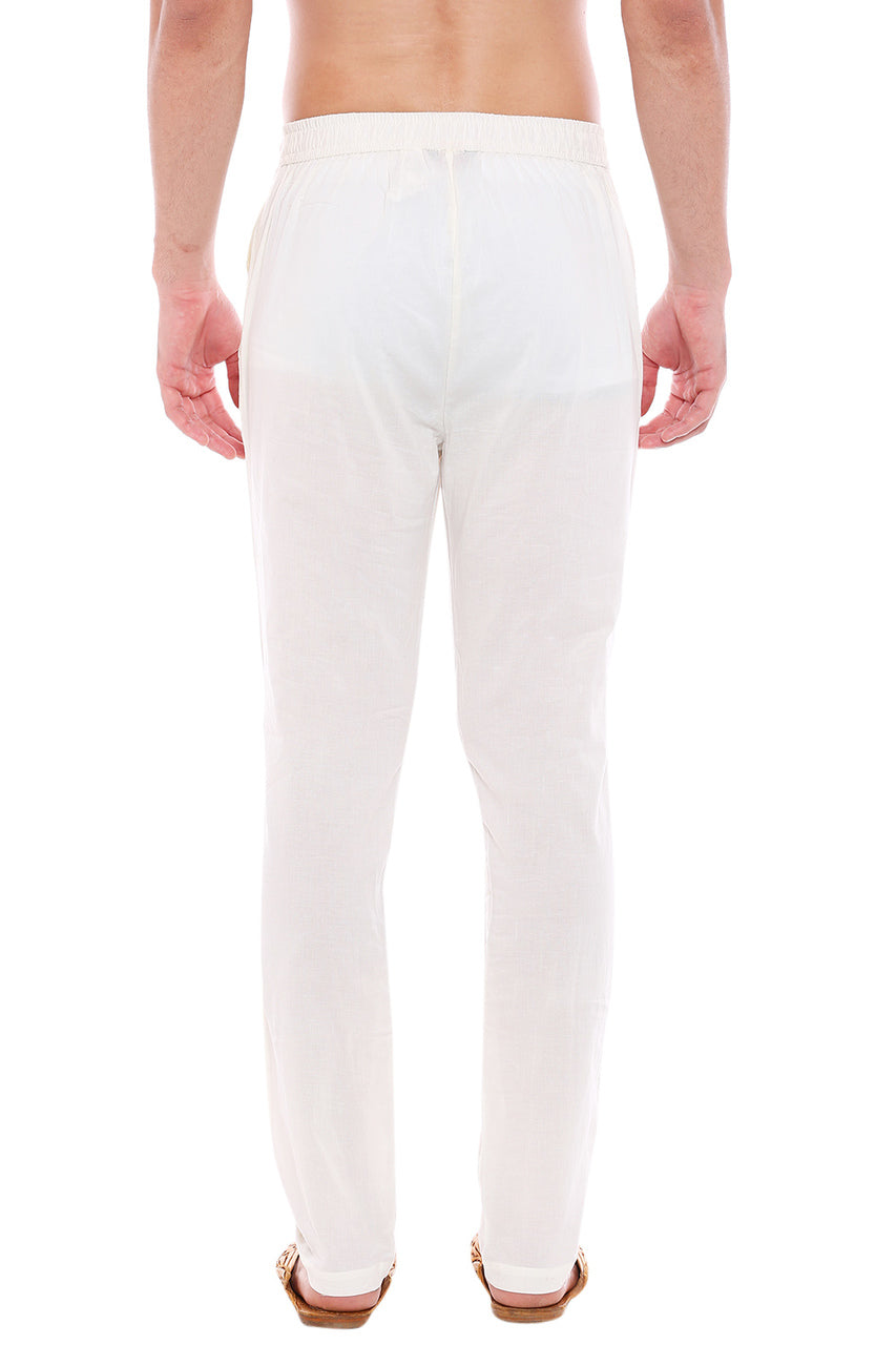 Back view of In-Sattva men's off-white cotton straight-cut pajama pants, showing the straight-cut shape and full-length drape from the back.