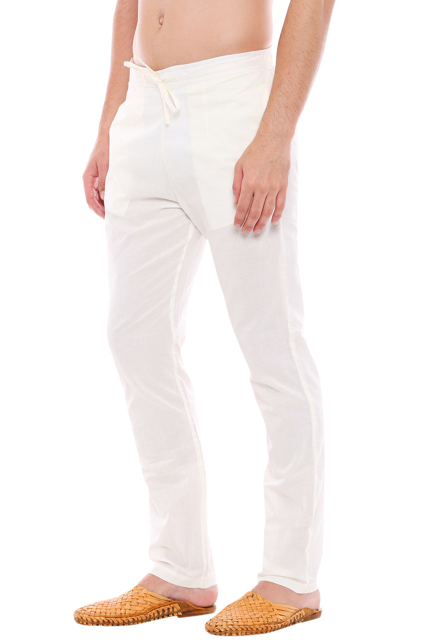 Right profile view of In-Sattva men's off-white cotton straight-cut pajama pants, showing the tailored full-length profile and straight hem.