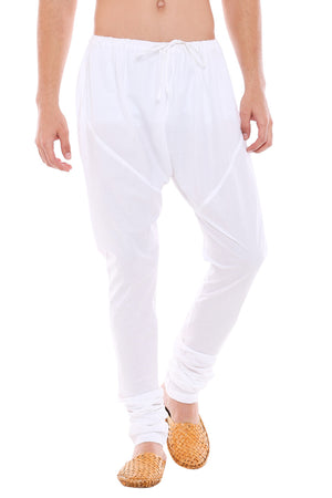 Front view of In-Sattva men's white cotton churidar pants, showing the drawstring waist, tapered legs and ankle gathers.