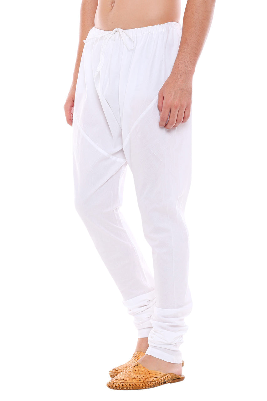 Right profile view of In-Sattva men's white cotton churidar pants, showing the smooth cotton profile and gathered ankle fit.