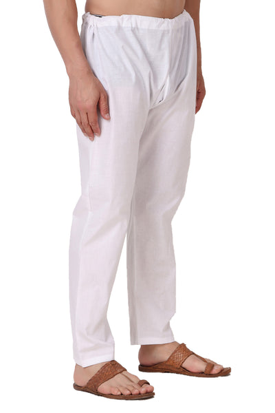 Left profile view of In-Sattva men's white cotton summer drawstring pants, showing the airy full-length silhouette for warm-weather wear.