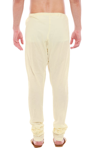 Back view of In-Sattva men's winter white cotton churidar pants, showing the tapered full-length fit and ankle gathers from the back.