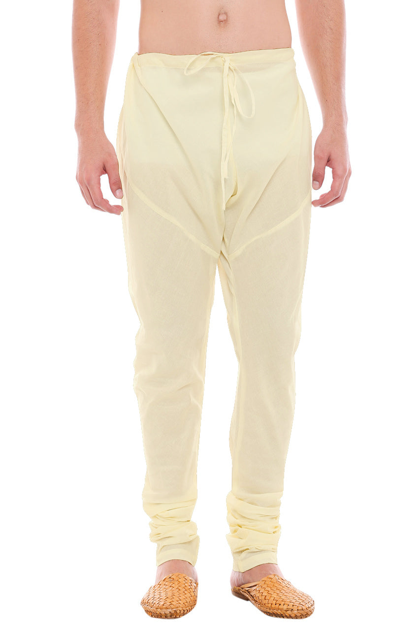 Front view of In-Sattva men's winter white cotton churidar pants, showing the drawstring waist, tapered legs and ankle gathers.
