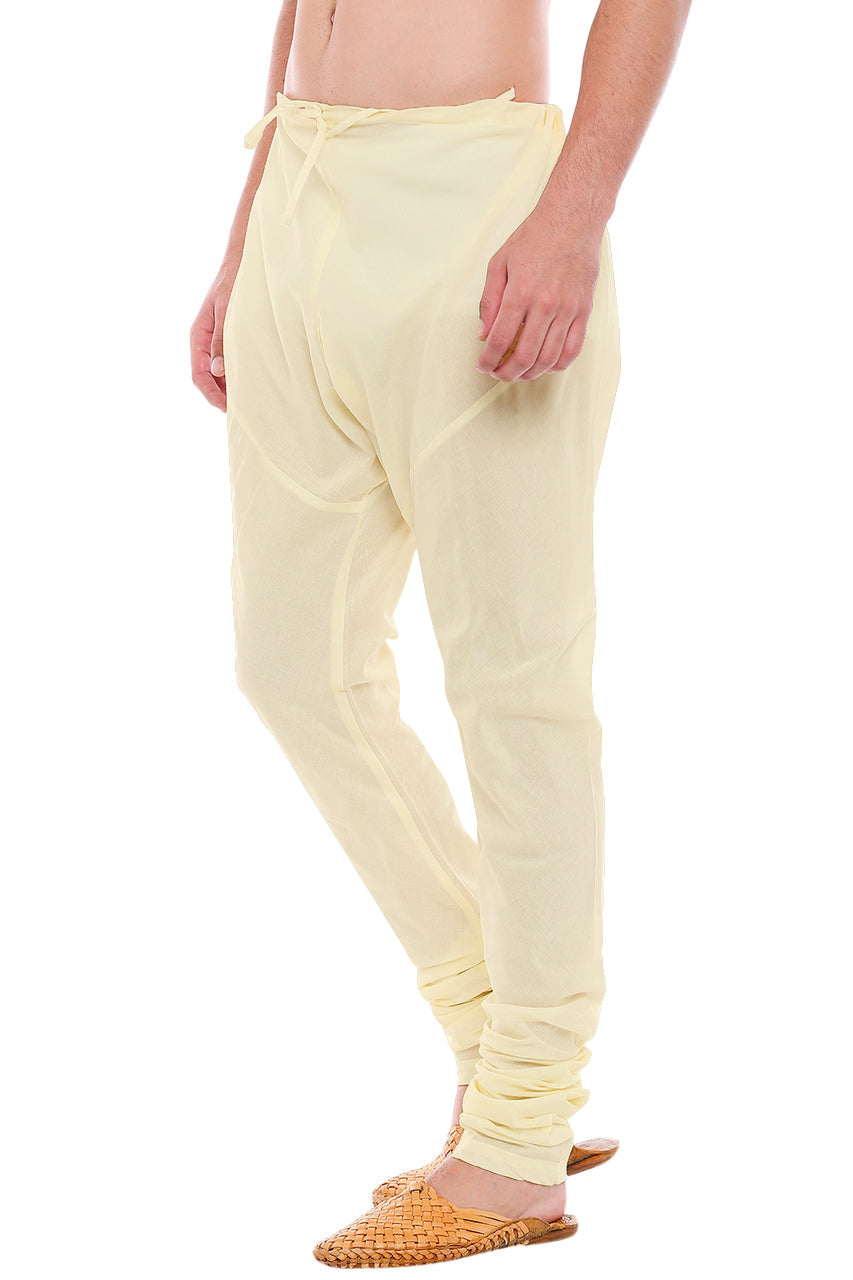 Right profile view of In-Sattva men's winter white cotton churidar pants, showing the smooth cotton profile and gathered ankle fit.