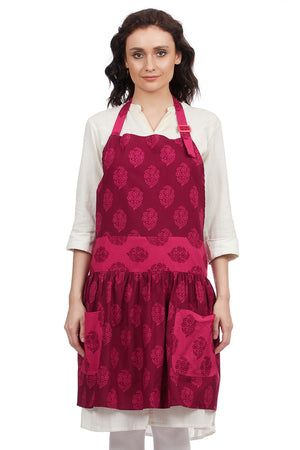Women's pink 100% cotton bohemian bib apron with roomy pockets and a frilly hem by In-Sattva