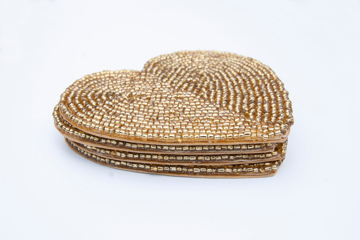 Stacked set of Rangeene gold handmade glass beaded heart shaped coasters