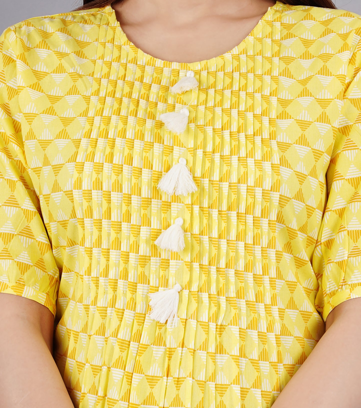 Sitayya Women's Pleated Yolk Geometric Pattern Yellow Top with Tassel Buttons | Detail View
