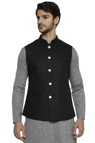Angled front view of men's black cotton-linen Nehru jacket vest, highlighting premium wedding guest style.