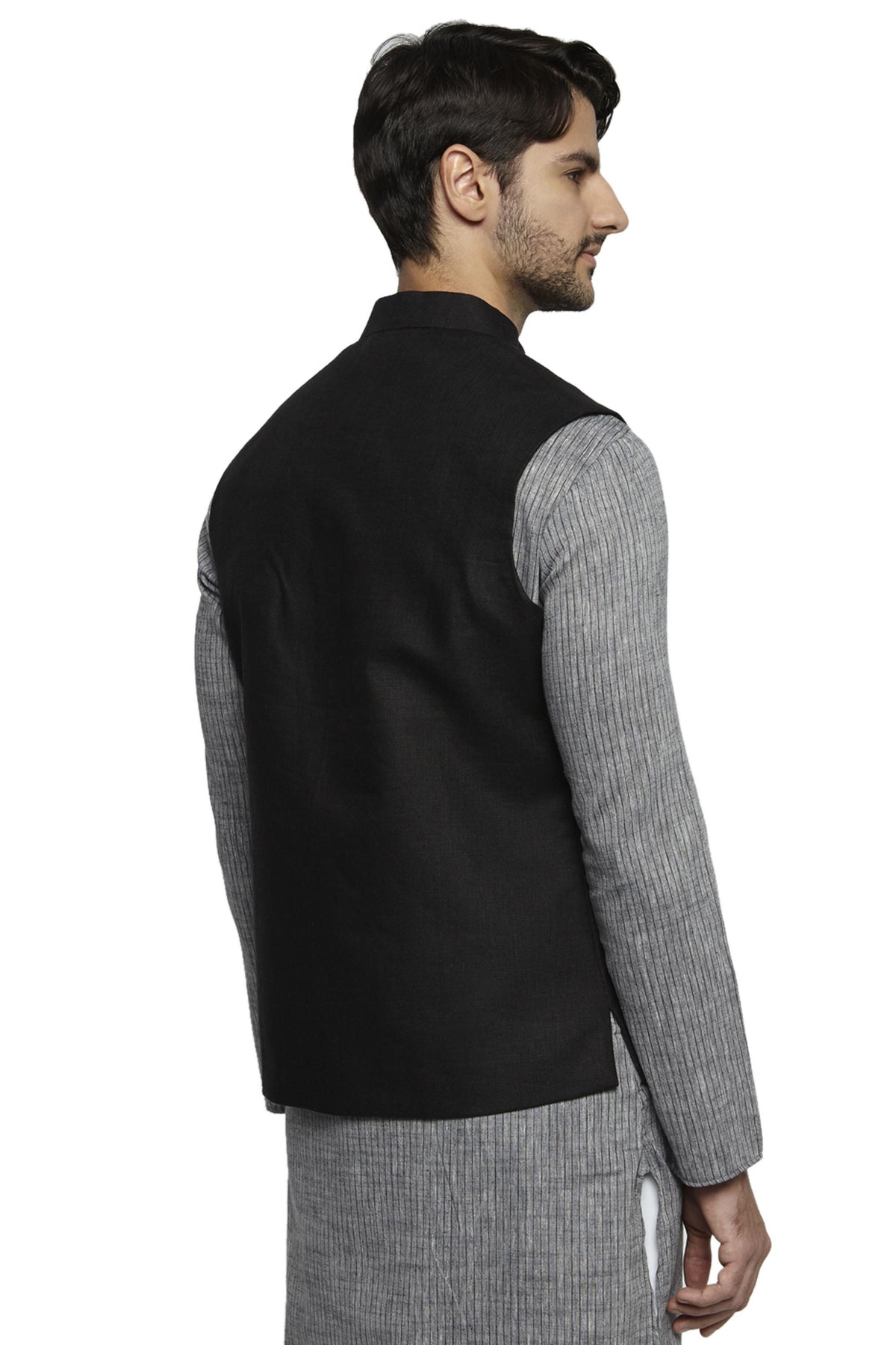 Collar and button close-up of men's black cotton-linen Nehru jacket vest, highlighting premium wedding guest style.