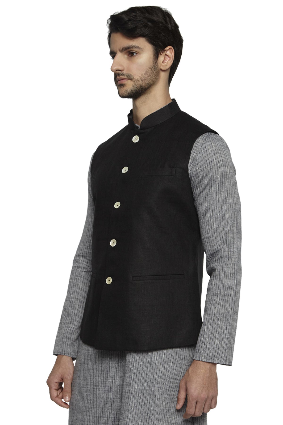 Side profile of men's black cotton-linen Nehru jacket vest, highlighting premium wedding guest style.