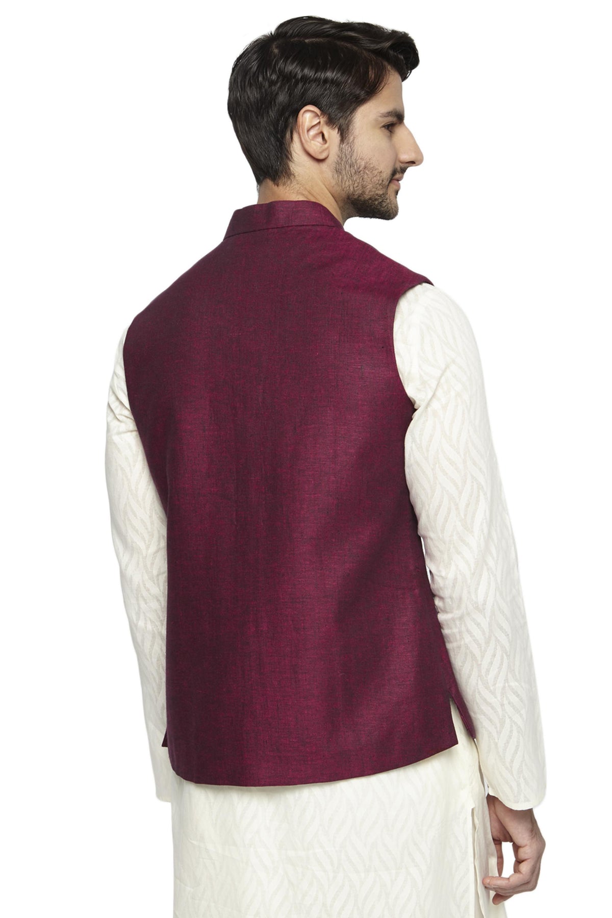 Collar and button close-up of men's maroon Nehru jacket vest, highlighting vibrant festive wedding guest style.