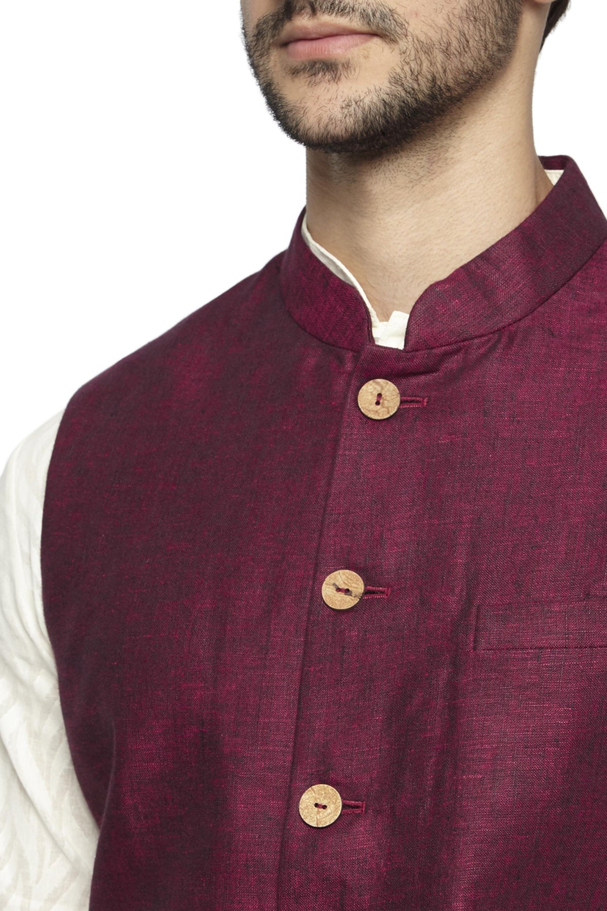 Front pocket close-up of men's maroon Nehru jacket vest, highlighting vibrant festive wedding guest style.