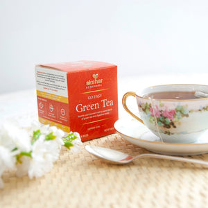 Akshar Ayurveda Go Easy Green Herbal Tea, 10 tea bags brewed tea product lifestyle image