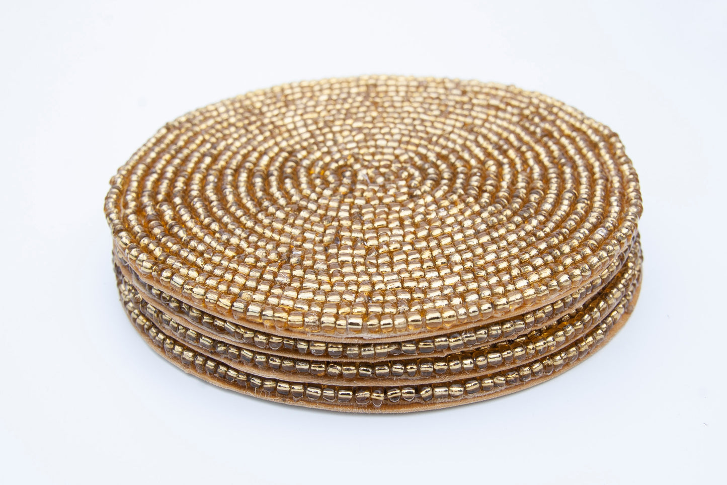 Stack of Rangeene Handmade Beaded Circle Gold Coaster 