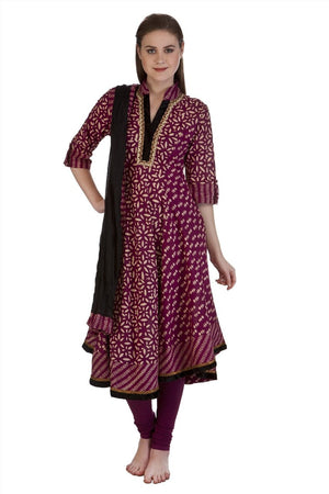 Front view of Meena Bindra Burgundy Petal Asymmetric Kurta Set, showing burgundy cotton with delicate petal-inspired motifs.