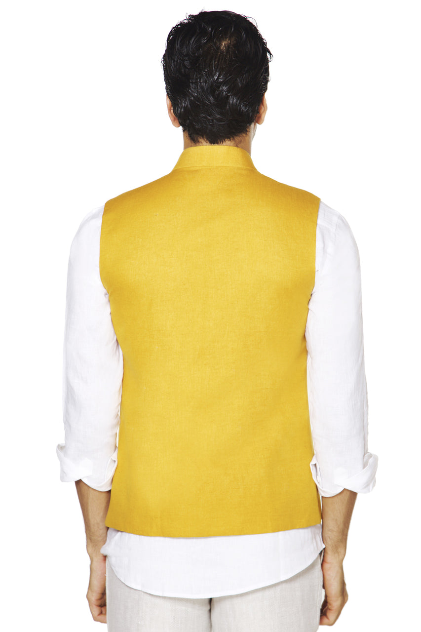 Back view of men's mustard Mandarin collar vest, highlighting vibrant festive wedding guest style.