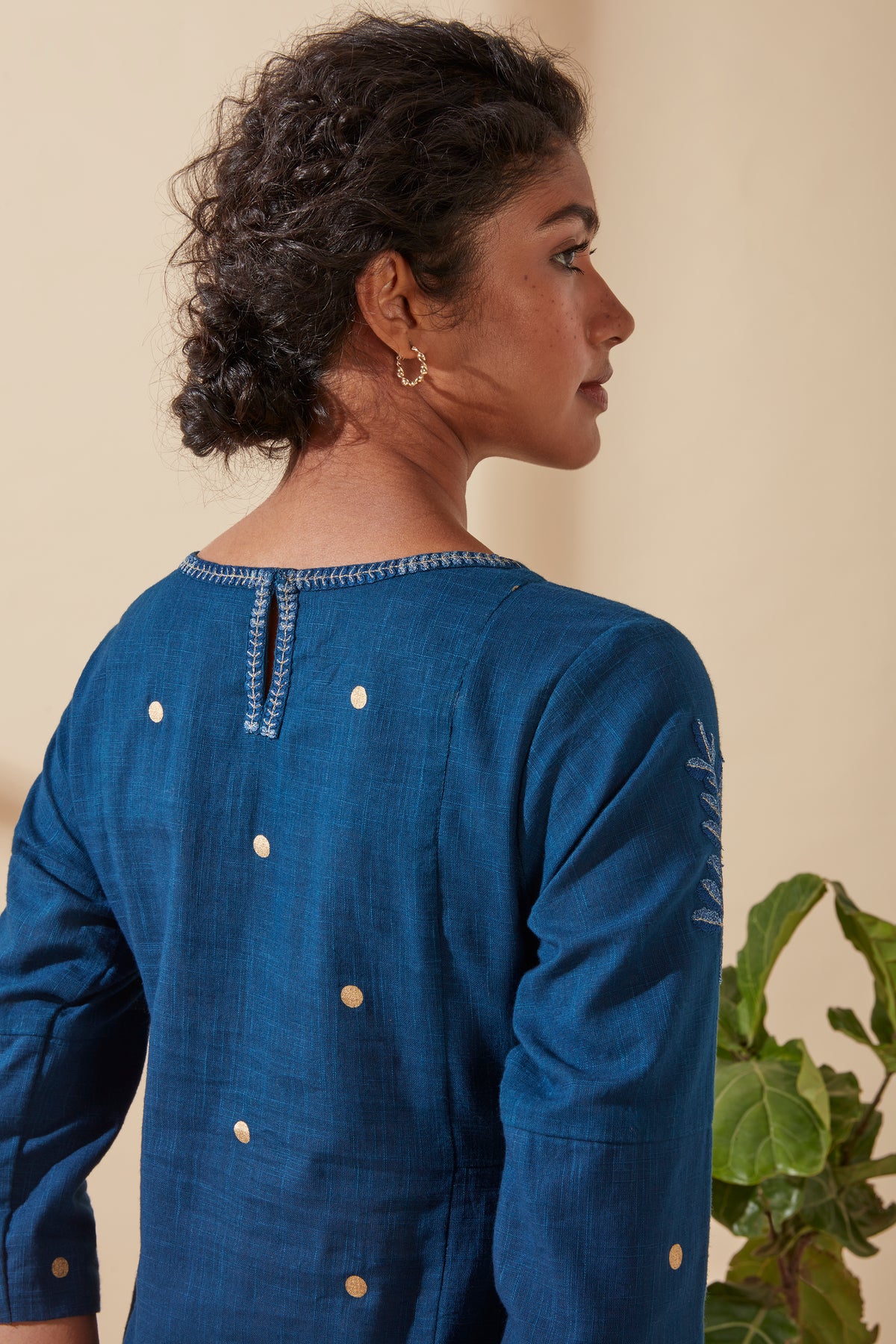 Detail view of Jove Women's Indigo Blue Cotton Kurta, showcasing gold polka-dot embellishments and traditional bohemian design details.