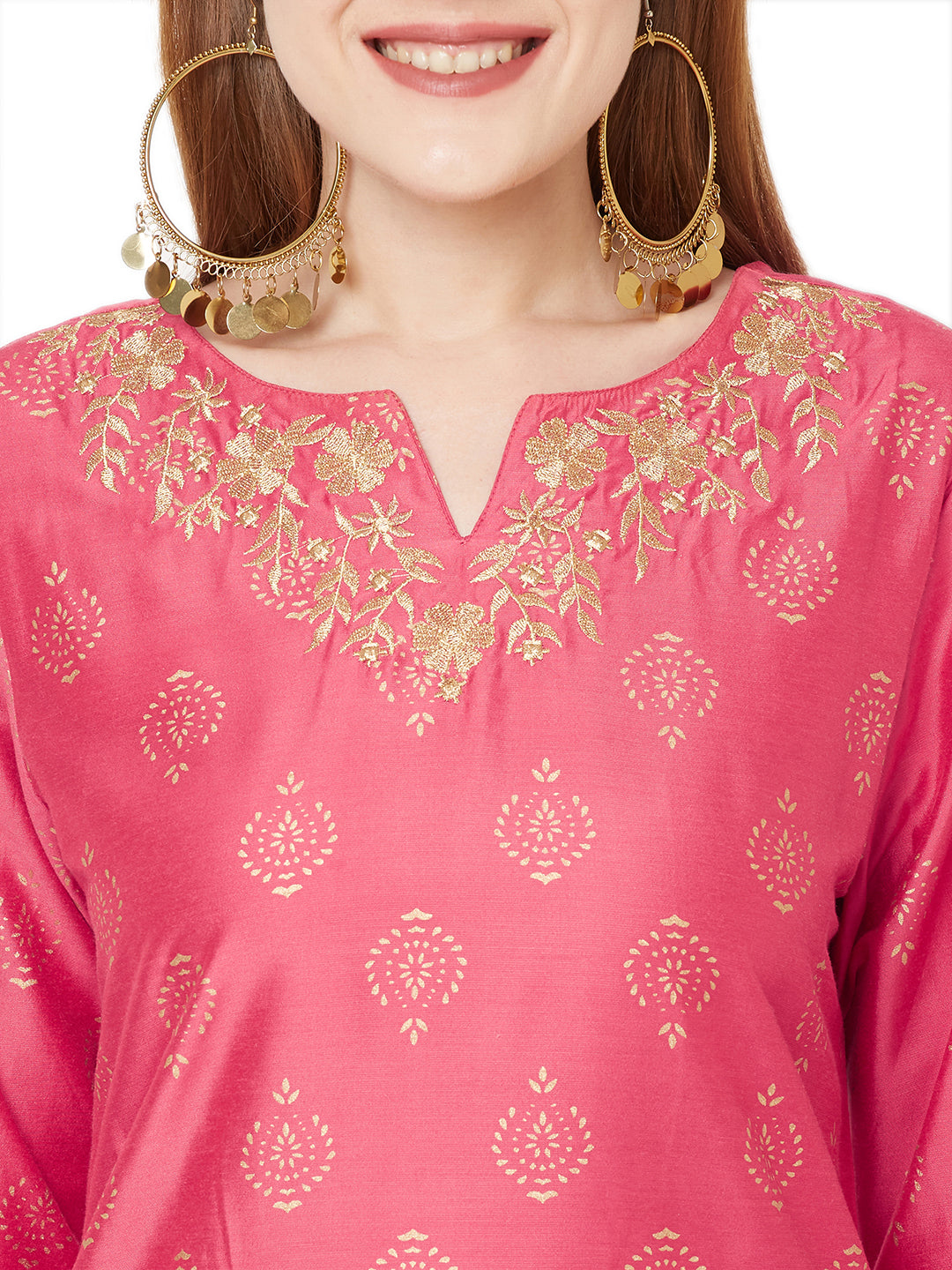 Detail view of Sitayya women's French pink kurta tunic, highlighting the golden leaf embroidery around the neckline, decorative threadwork and gold block-printed cotton fabric.