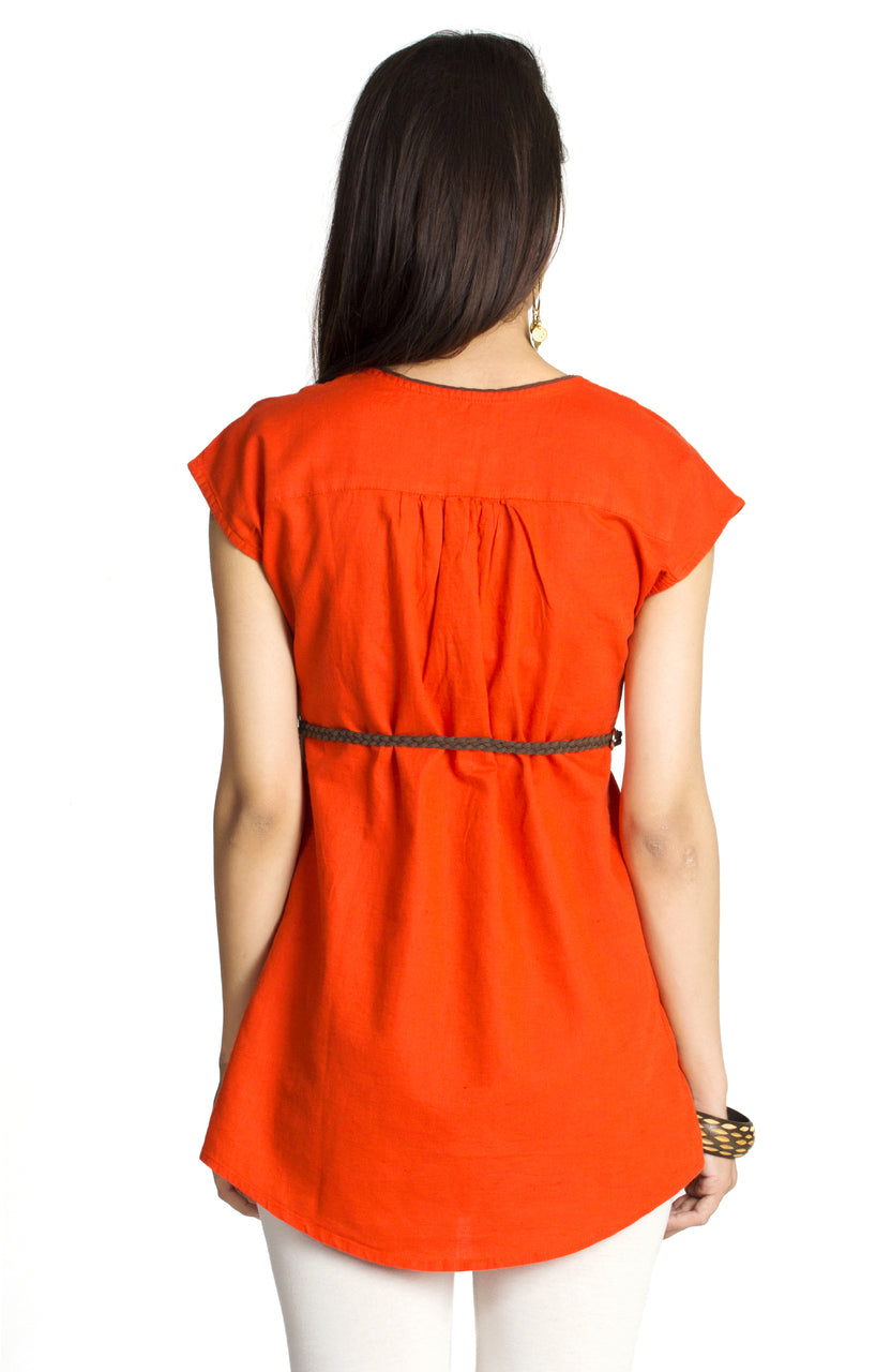 In-Sattva Women's Orange Tunic Top featuring contrast piping and cap sleeves, back view