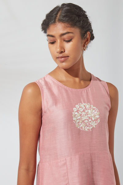 Angled front view of Jove Women's Sea Pink Embroidered Kurta Dress, showcasing the relaxed fit, silk-linen fabric and functional pocket design.
