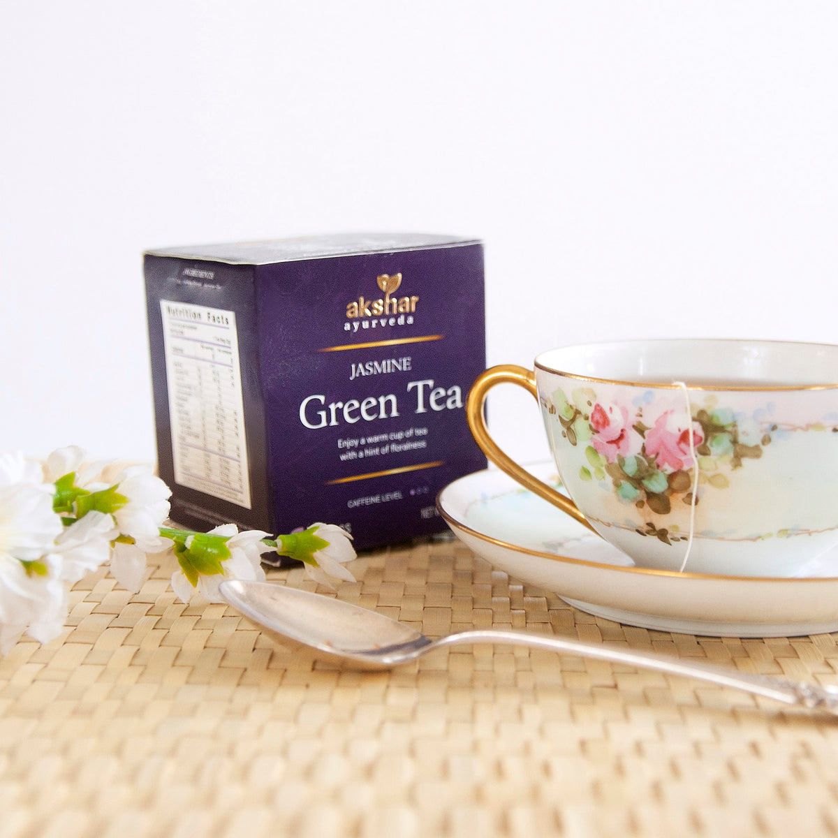 Akshar Ayurveda Jasmine Green Herbal Tea, 10 tea bags brewed tea product lifestyle image