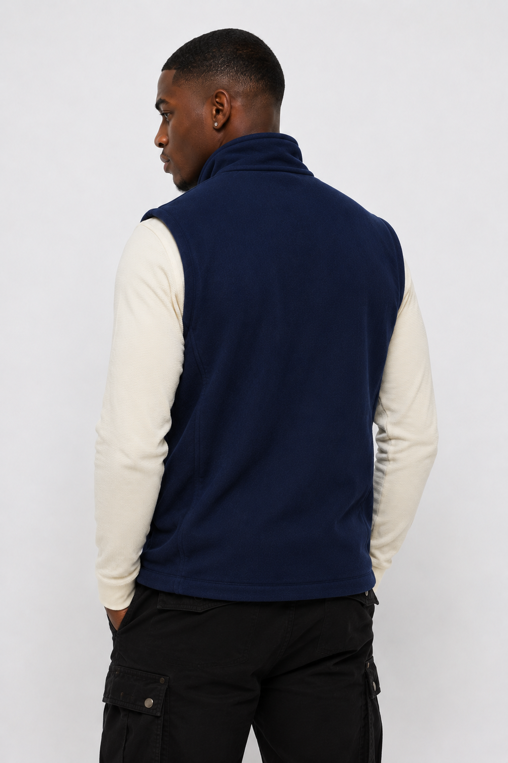 Full-length back view of men's blue softshell zip-up vest, highlighting weather-resistant outdoor wear.