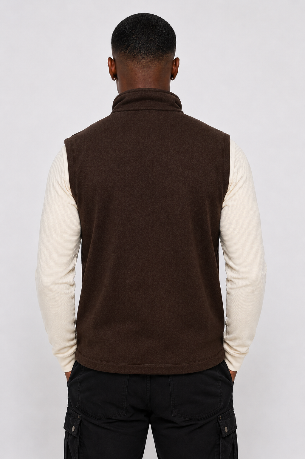 Angled front view of men's brown softshell zip-up vest, highlighting weather-resistant layering built to last.