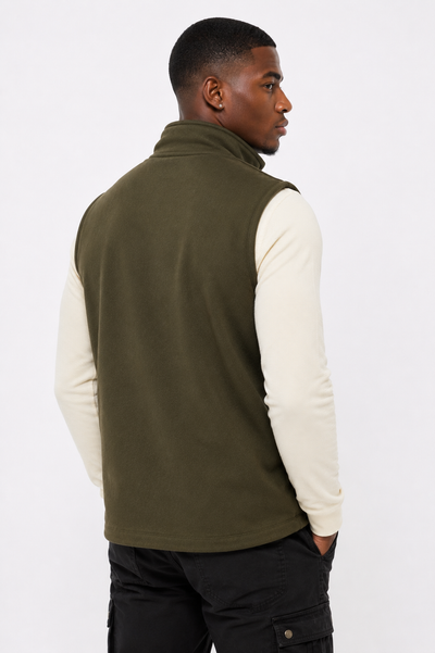 Angled front view of men's olive green softshell zip-up vest, highlighting weather-resistant outdoor wear.