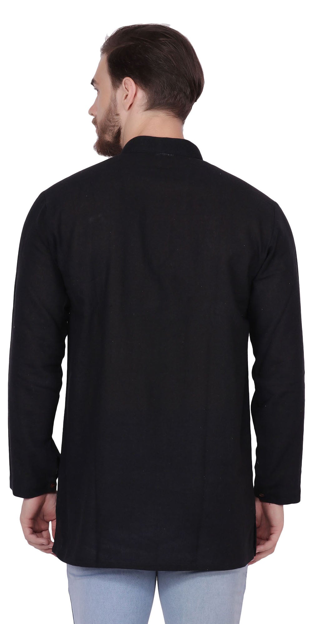 Back view of a model wearing In-Sattva's men's black handmade khadi cotton thigh-length kurta tunic, showing the plain khadi cotton texture across the back, long sleeves and straight hem.