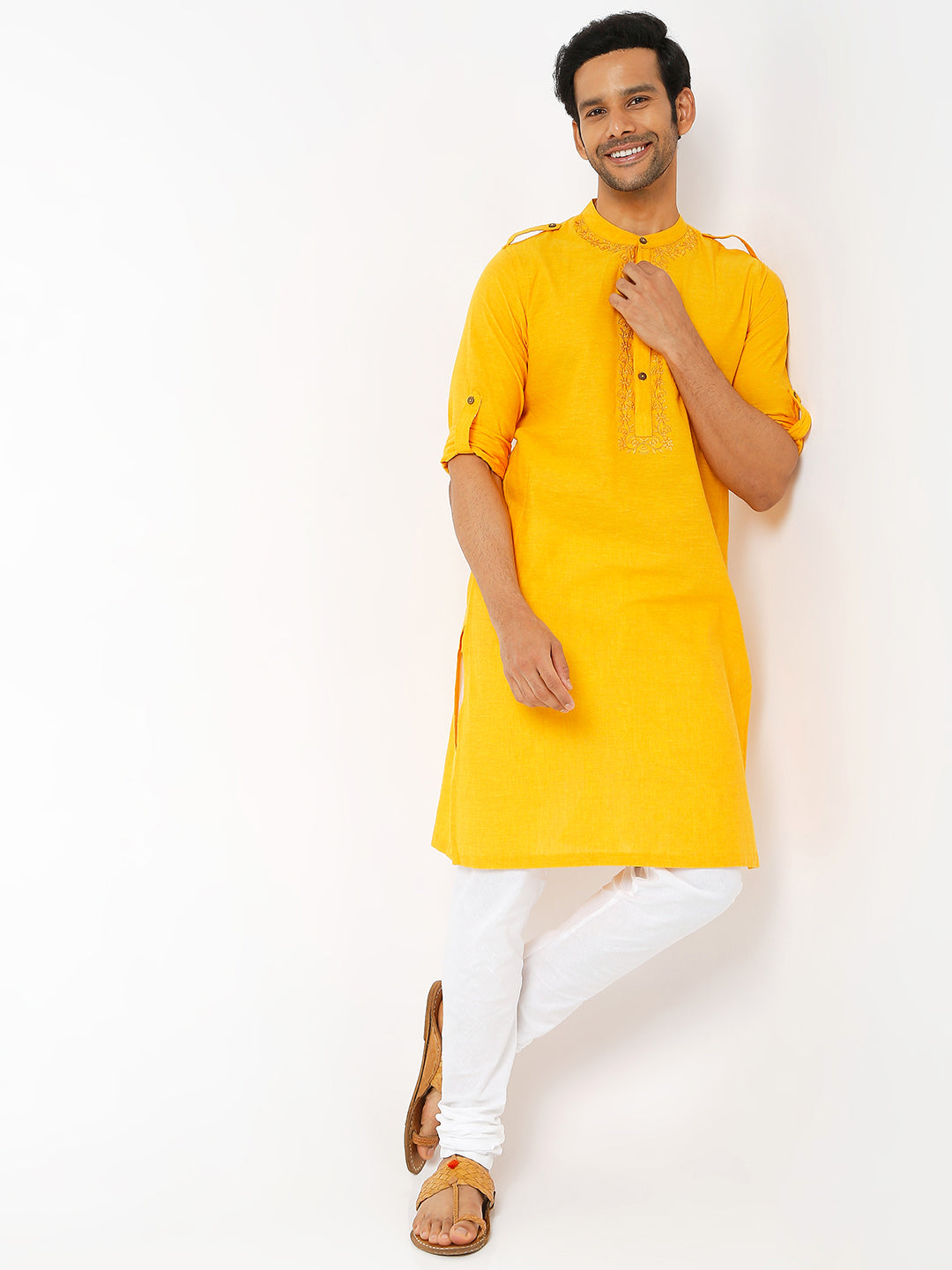 Men's golden yellow cotton knee-length kurta, close-up detail.
